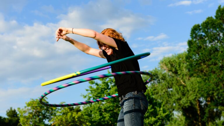 Woman hula hooping outdoors